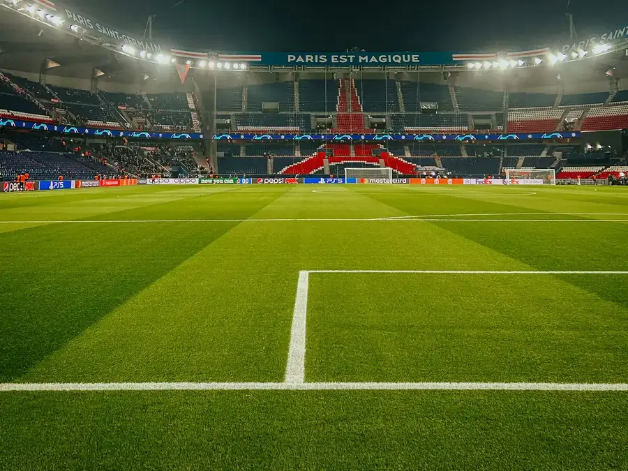 Empty soccer stadium under the lights before a match